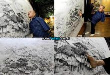 O artista chinês Huang Guofu pinta usando apenas a boca e os pés 12