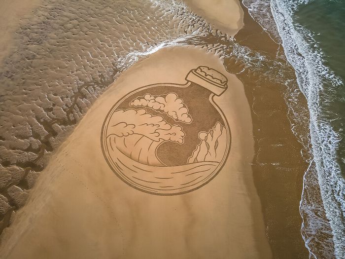 Artista produz grandiosas obras de arte na areia da praia (32 fotos) 8