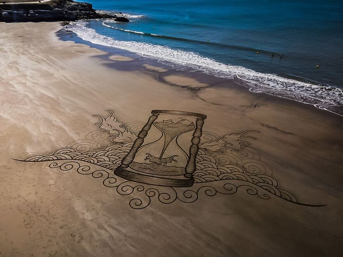 Artista produz grandiosas obras de arte na areia da praia (32 fotos) 13