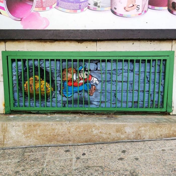 Artista francês cria arte humorística nas ruas de Paris 24