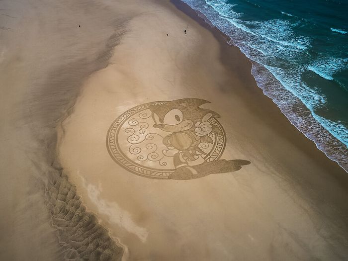Artista produz grandiosas obras de arte na areia da praia (32 fotos) 2