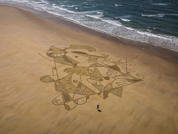 Artista produz grandiosas obras de arte na areia da praia (32 fotos) 3