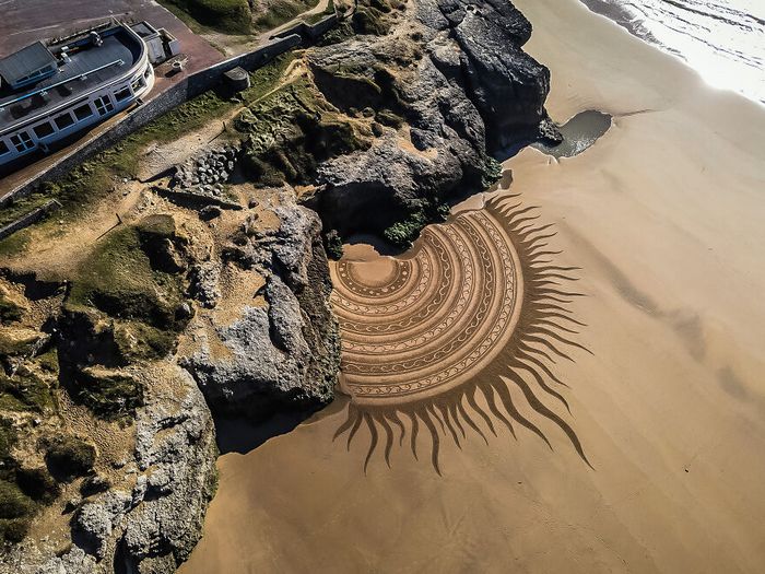 Artista produz grandiosas obras de arte na areia da praia (32 fotos) 5