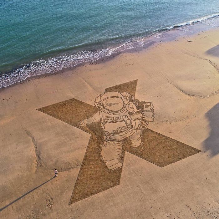 Artista produz grandiosas obras de arte na areia da praia (32 fotos) 23