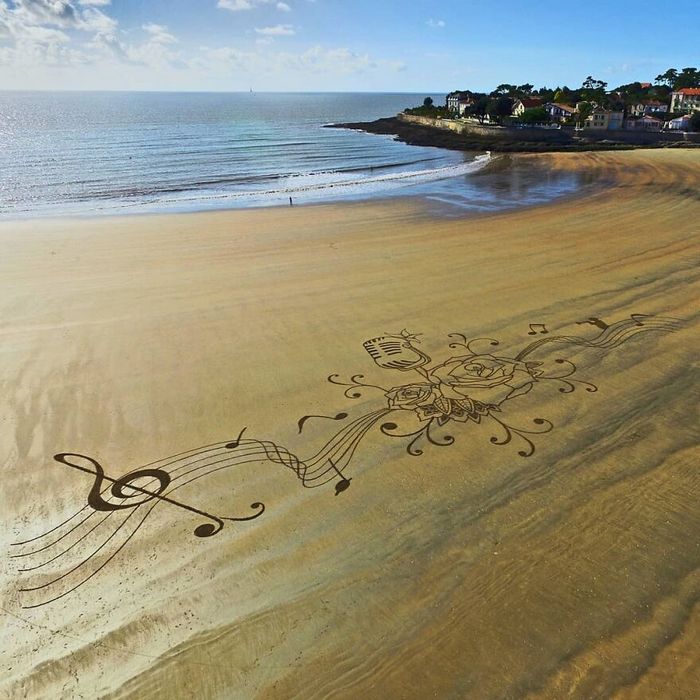 Artista produz grandiosas obras de arte na areia da praia (32 fotos) 24